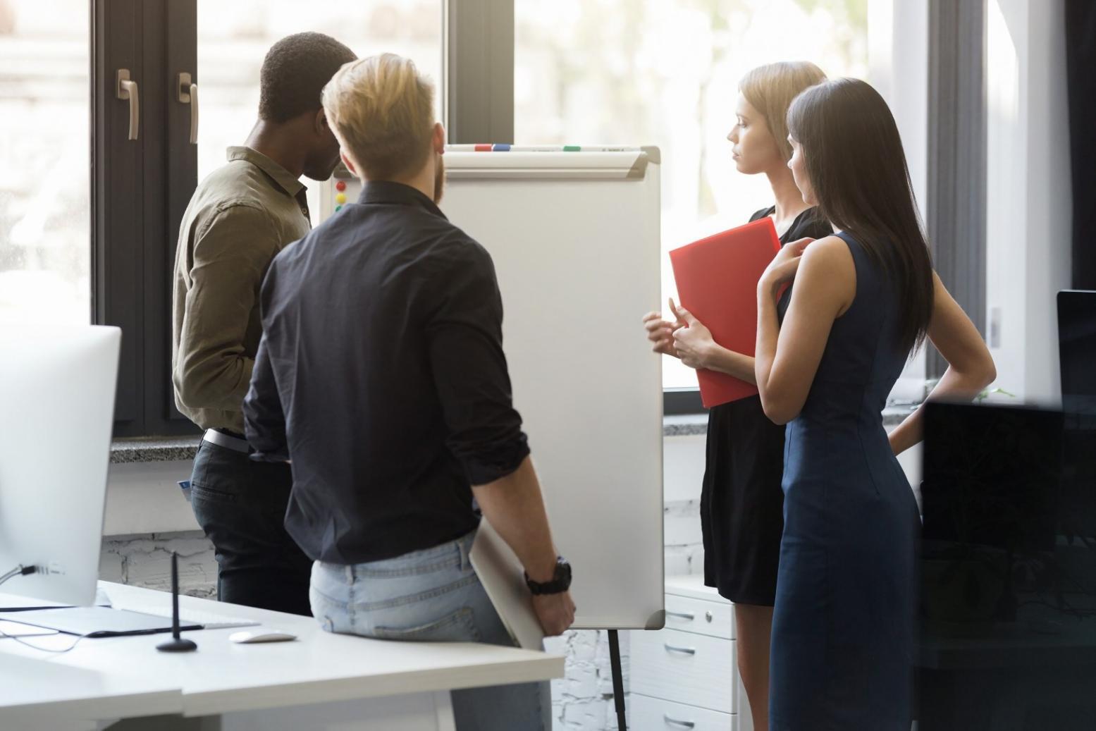 Group of finance students engaged in collaborative problem-solving session