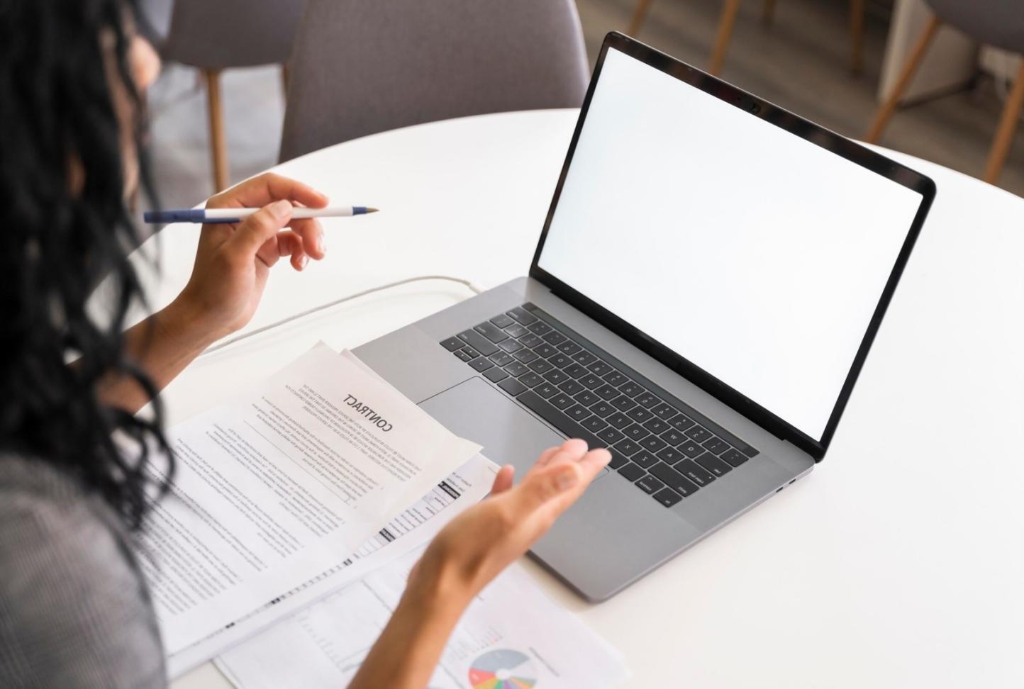 Clean workspace showing structured learning materials and financial charts for quick reference